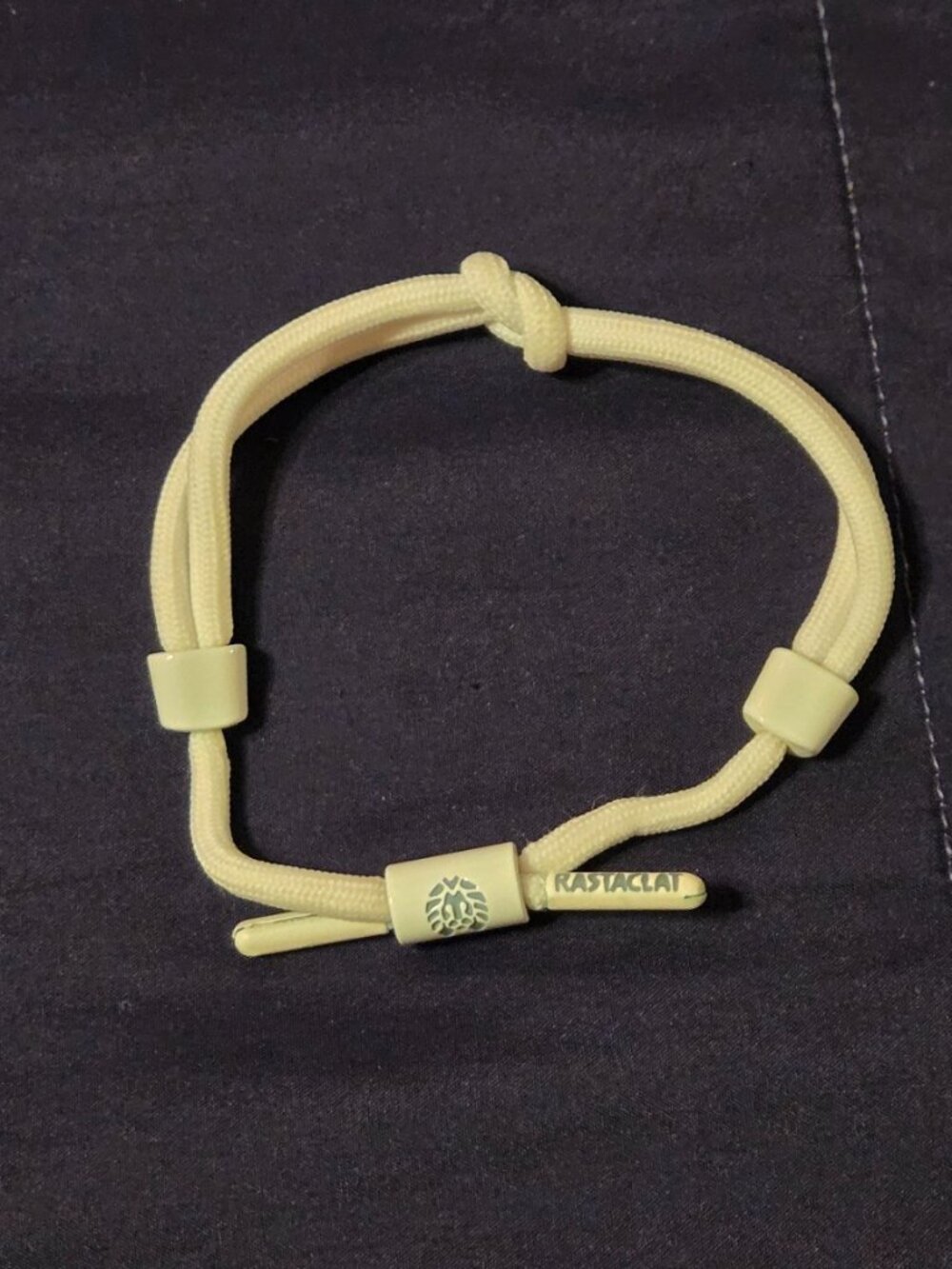 RASTACLAT KNOTTED SHOELACE BRAIDED PULL TO CLOSE BRACELET.